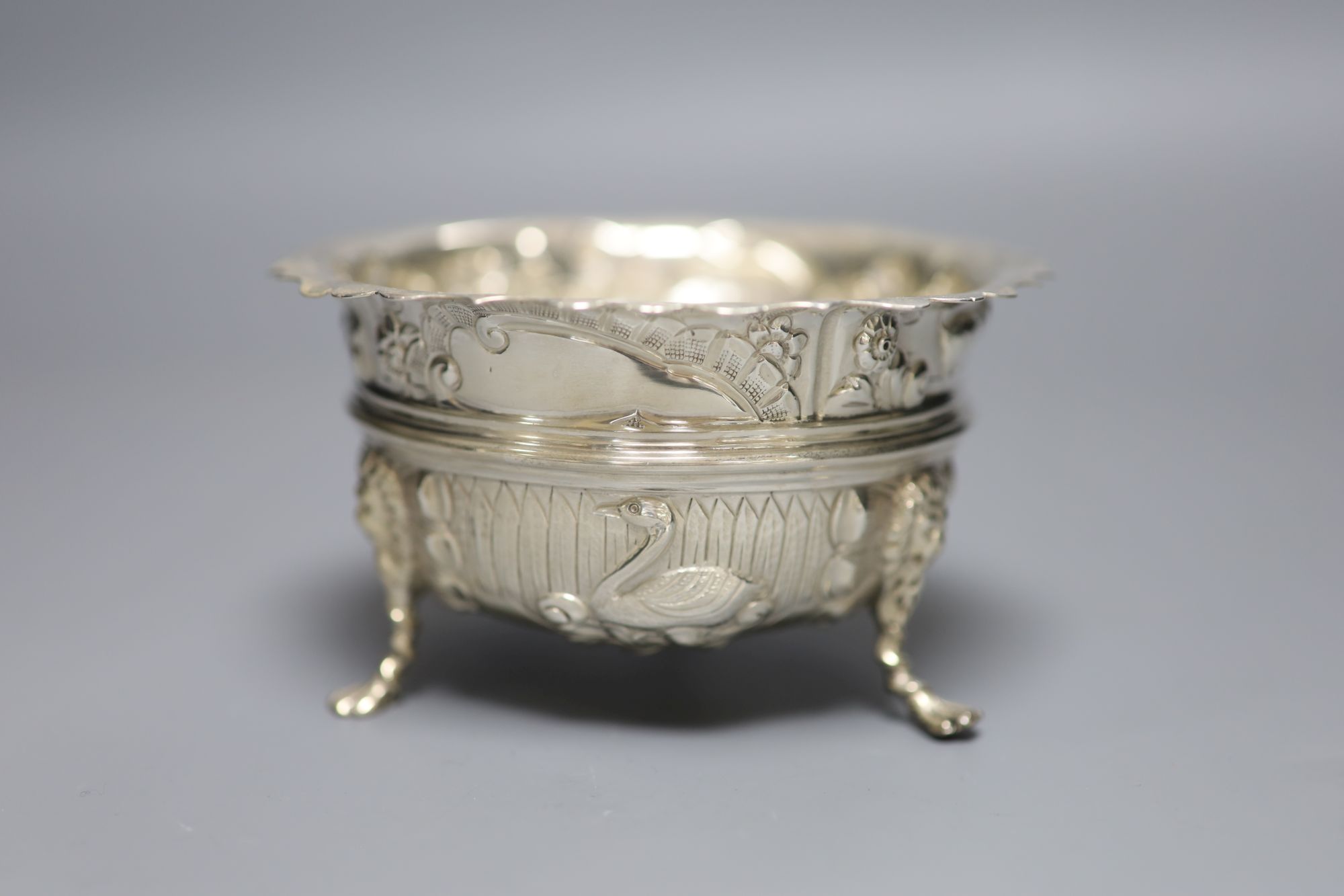 A late Victorian embossed silver sugar bowl, Nathan & Hayes, Chester, 1900m height 67mm, 5.5oz.